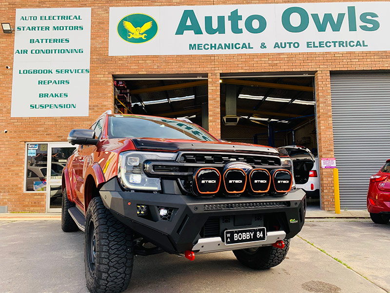 Auto Owls team inside the workshop