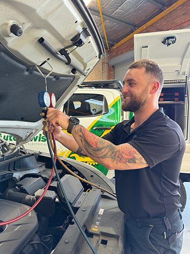 Auto Owls mechanic servicing a vehicle in Bentley workshop